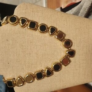 Gold tone abstract necklace